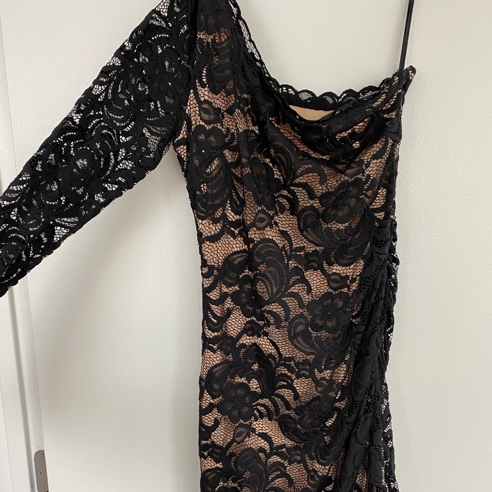 Bebe Size M black dress with tan lining